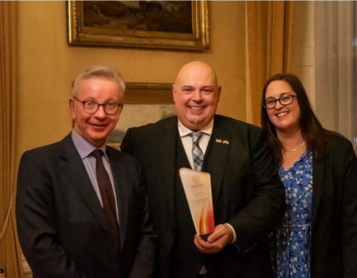 Incoming Aberdeen Conservative group leader Rick Brooks collects the gong for the Scottish Charity of the Year for TLC, alongside wife Amy and Tory Levelling Up Secretary Michael Gove. Image: TLC