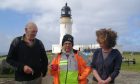John Ure (left) and his daughter Angie (right), at the Cape Wrath Lighthouse with TV presenter Timmy Mallet, who was visiting Ozone Cafe. Supplied by Ozone Cafe
