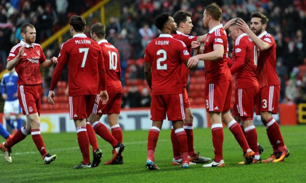 Aberdeen's players celebrate scoring the opening goal in a Scottish Cup tie with Stranraer at Pittodrie on January 21, 2017. Image: Darrell Benns/DC Thomson.