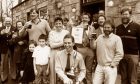 Proprietor of CAMRA's UK Pub of the Year, The Boar's Head at Kinmuck, Stuart Singer, centre, pictured with his wife Margaret, their family and pub regulars after the presentation in April 1989. Image: DC Thomson