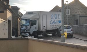 Lorry and car collide.