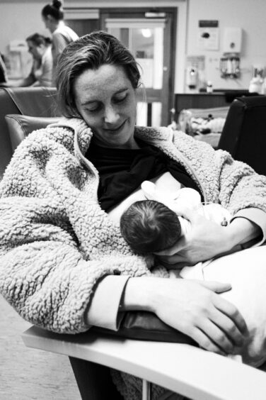 Hannah Miley holding baby Nula