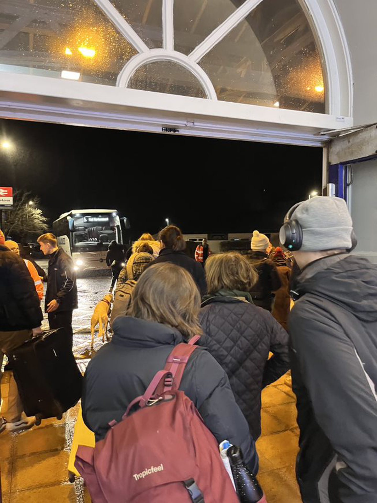 Passengers flock to the bus after waiting at Stonehaven station for seven hours.