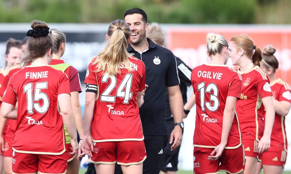 Aberdeen FC Women manager Clint Lancaster with his players after a SWPL match.