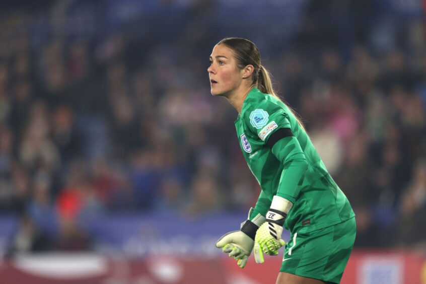 Goalkeeper Mary Earps in action for England in a Nations League match against Belgium.