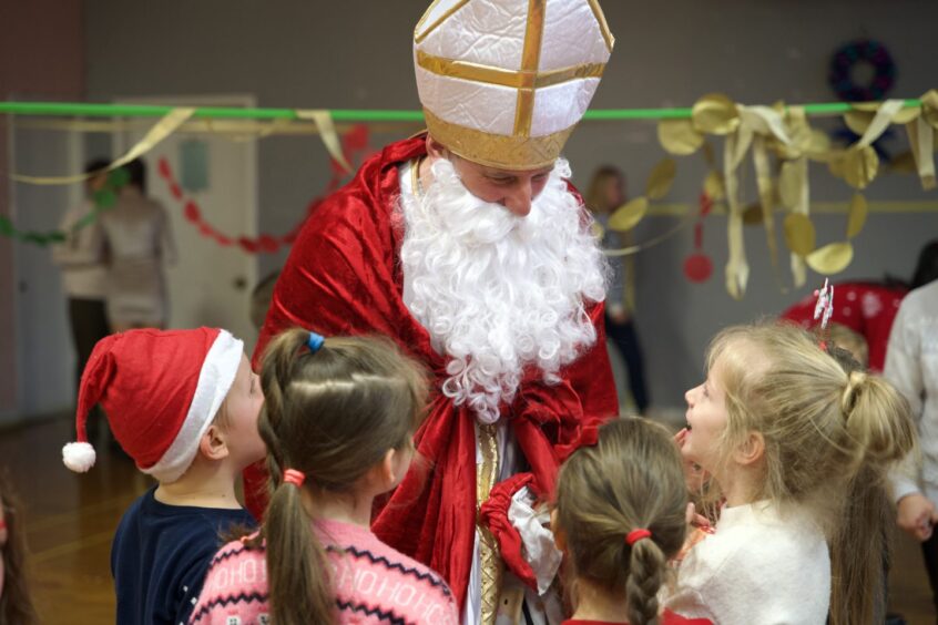 Saint Nicholas with Ukrainian refugee children in Aberdeen on Sunday.