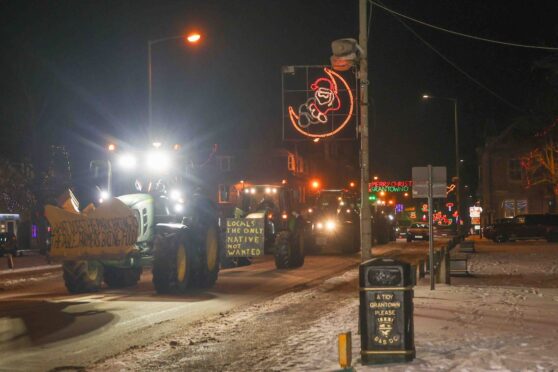 Farmers form a tractor convoy as they protest through Grantown-on-Spey.