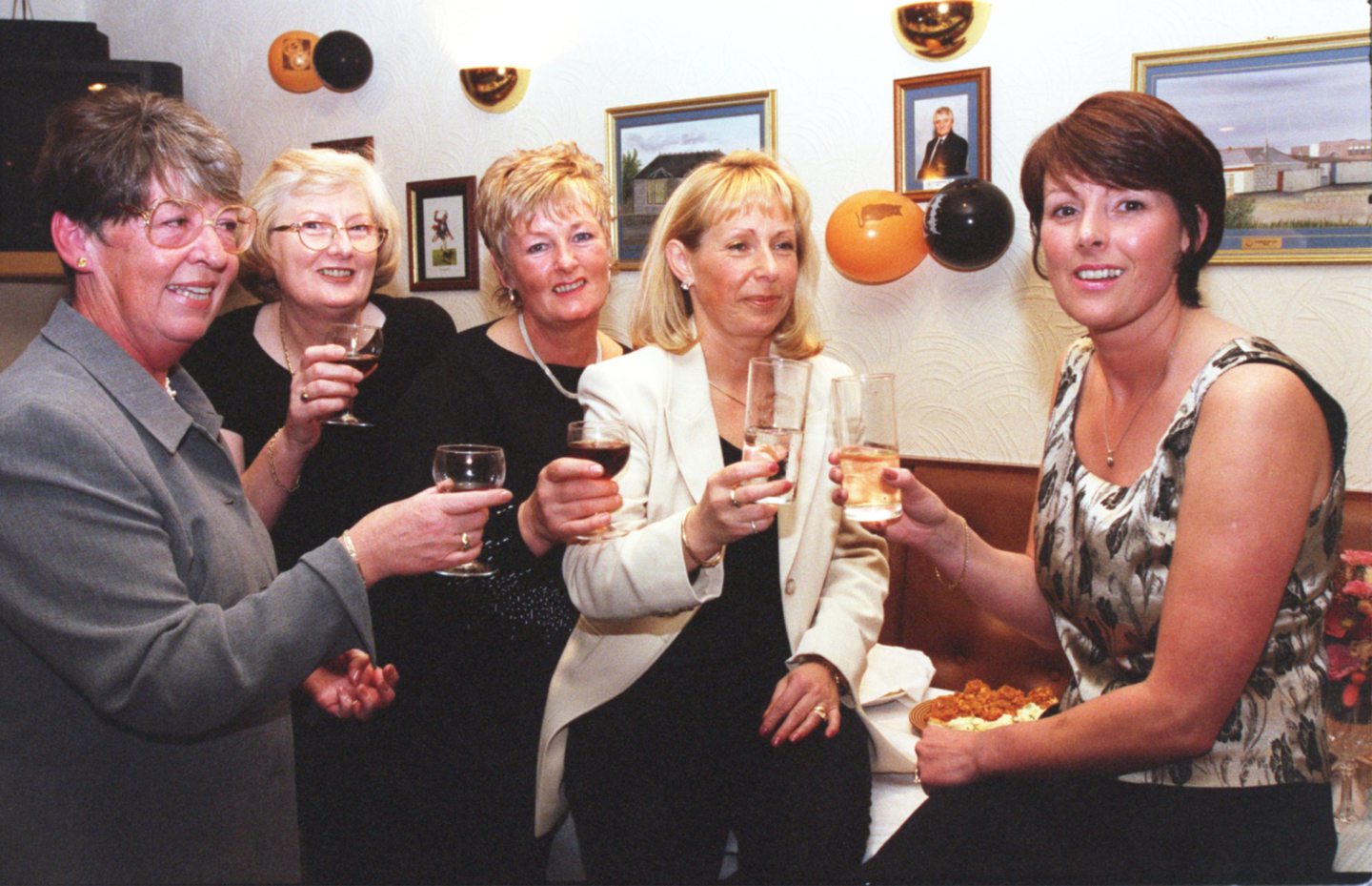 A group of staff toasting