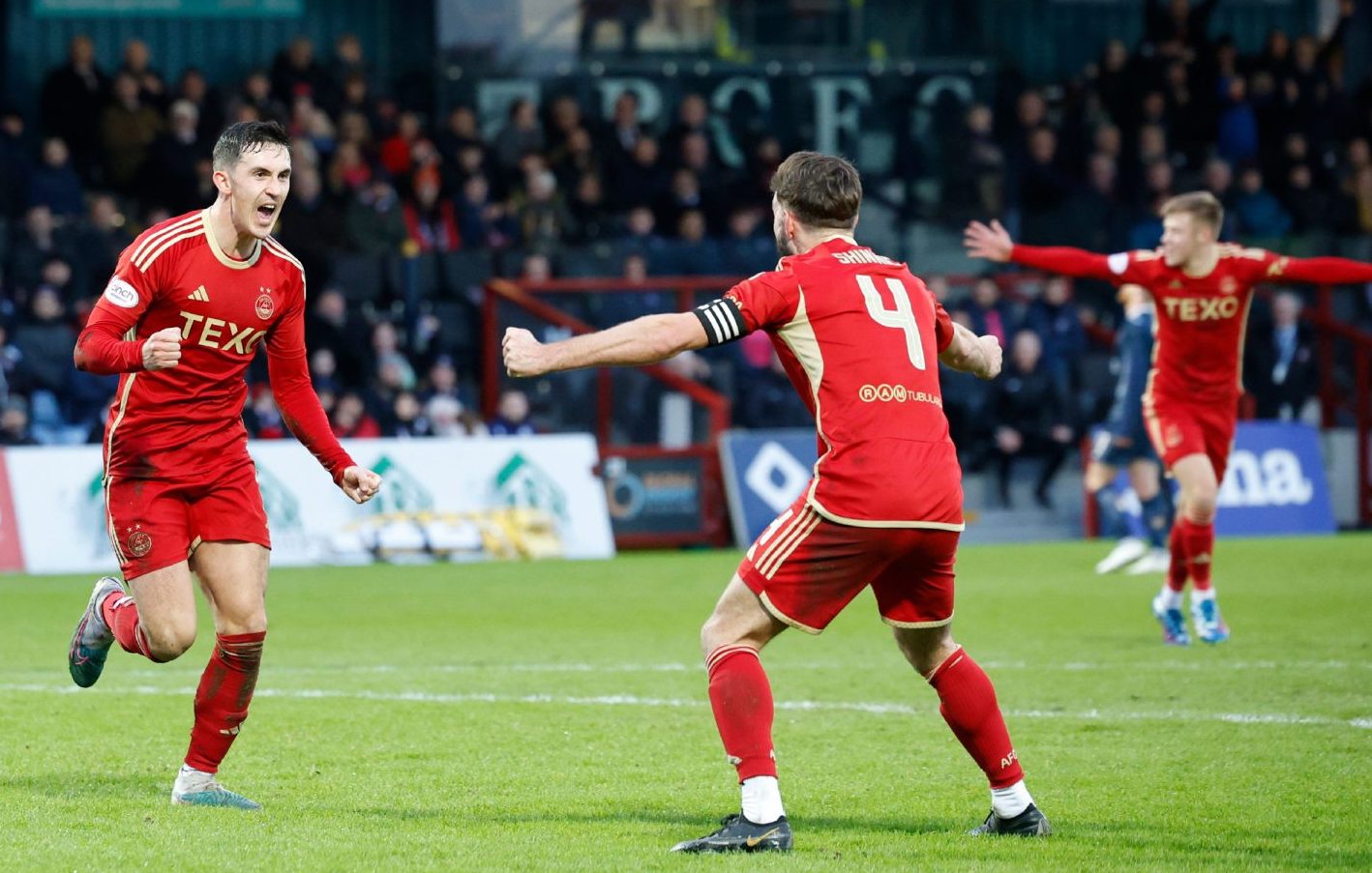 Jamie McGrath (7) of Aberdeen celebrates scoring to make it 1-0 against Ross County in Dingwall. Image: Shutterstock.