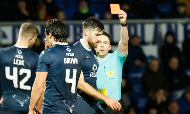 Ross County's Jack Baldwin is shown a red card in the match against Aberdeen. Image: Shutterstock.