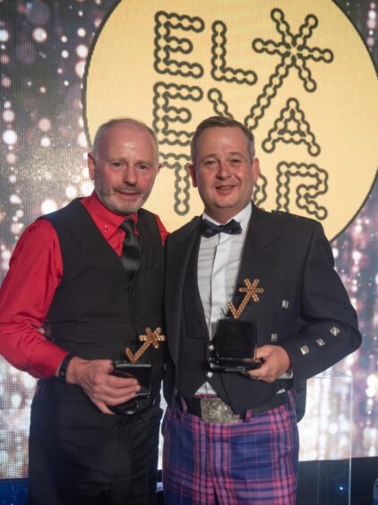 Stewart Milne, left, clucthes his Elevator lifetime achievement award. With him is Knight Property Group's James Barrack, who was named entrepreneur of the year at the 2019 ceremony. 