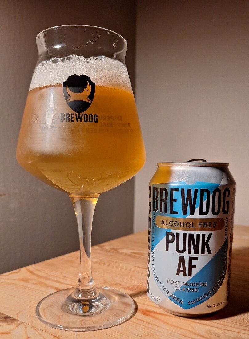 A can of Punk AF, poured into a glass. 