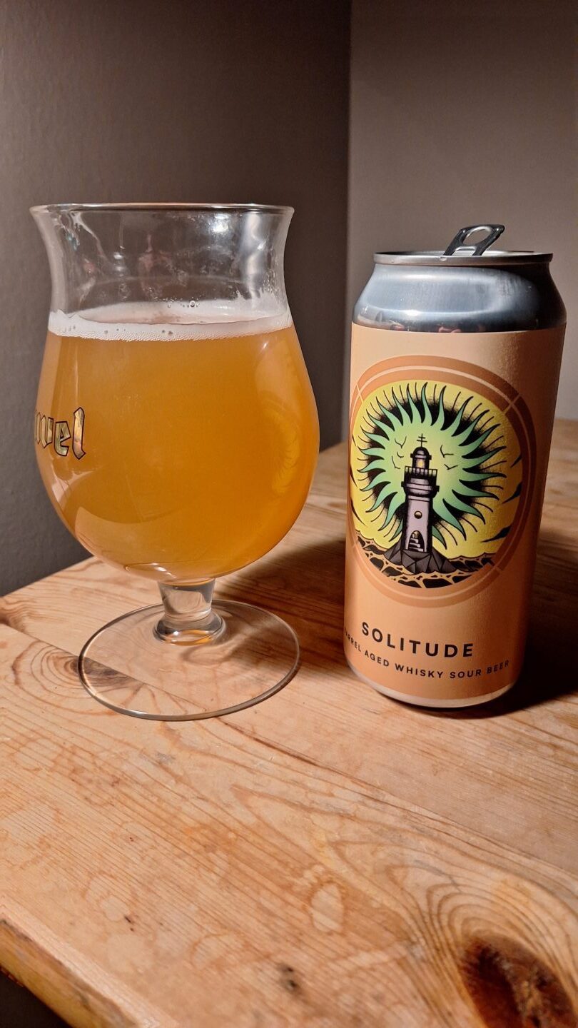 The Solitude whisky sour beer from Otherworld Brewing poured into a glass. 