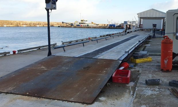 Buckie harbour weighbridge general view with harbour behind.