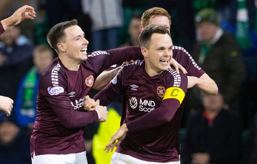 Hearts' Lawrence Shankland celebrating a goal with Barrie McKay and Kye Rowles