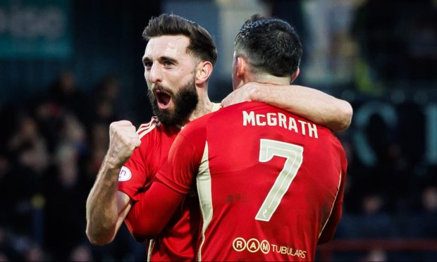Aberdeen's Jamie McGrath (right) celebrates with team mate Graeme Shinnie after scoring to make it 1-0 against Ross County. Image: SNS