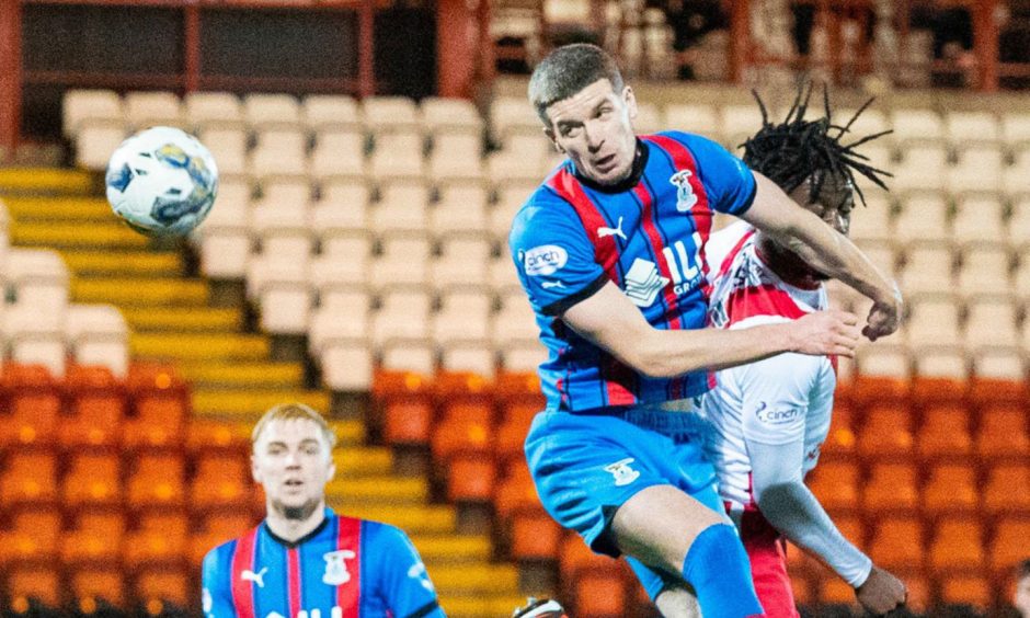 Inverness midfielder Charlie Gilmour challenges Airdrie's Kanayo Megwa.