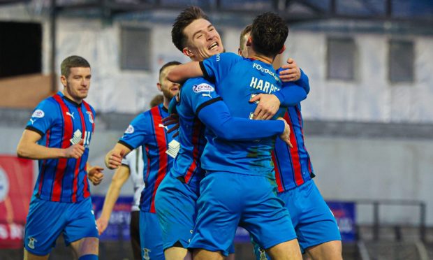 Morgan Boyes celebrates with team-mates after scoring to make it 2-0 to Inverness.