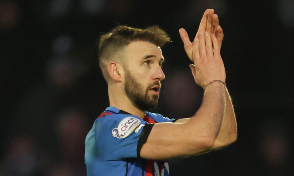 Sean Welsh applauds the Inverness fans 