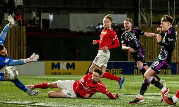 Aberdeen's Nicky Devlin scores to make it 2-0 against Clyde. Image: SNS.