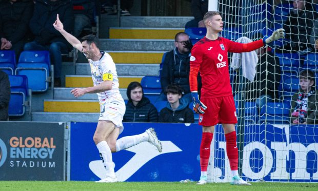 Partick's Brian Graham celebrates making it 1-0 against Ross County. Image: SNS.