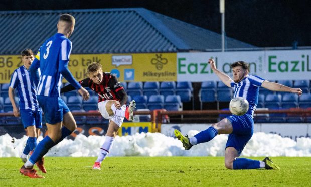 Caley Thistle forward Adam Brooks scores the first of his two goals against Broomhill in the Scottish Cup fourth round.