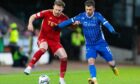 Aberdeen's Nicky Devlin and St Johnstone's Graham Carey in action. Image: SNS