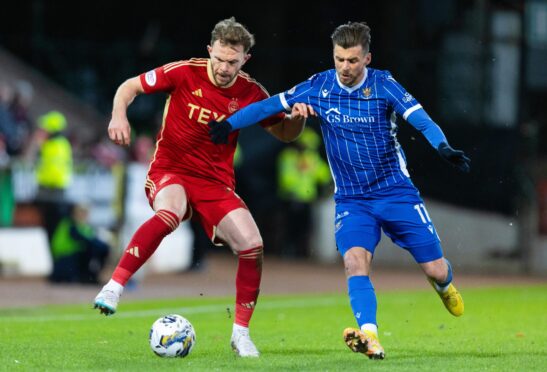 Aberdeen's Nicky Devlin and St Johnstone's Graham Carey in action. Image: SNS