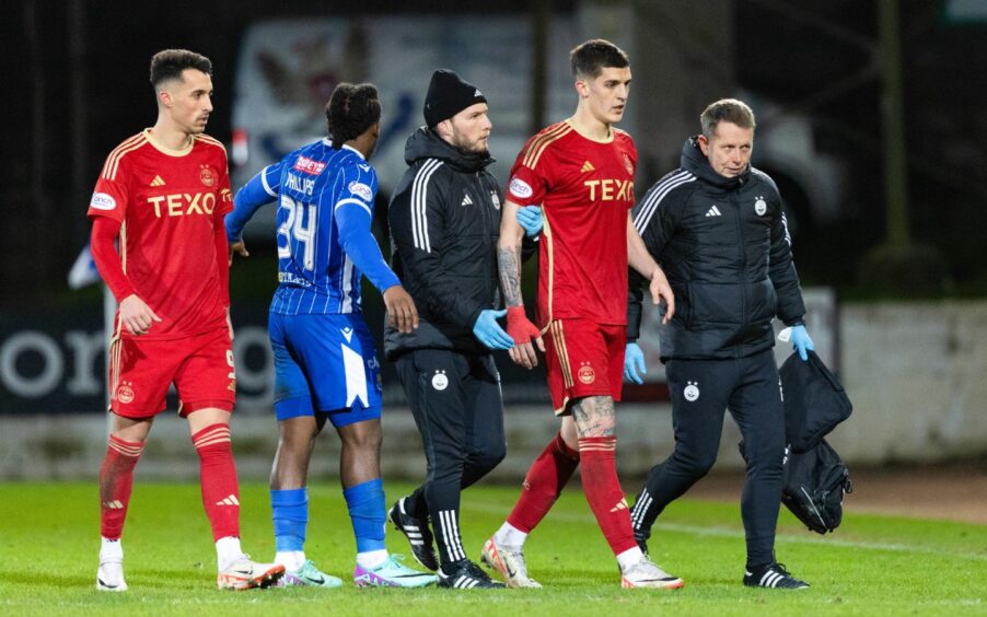 Aberdeen's Slobodan Rubezic goes off injured in the 1-1 draw at St Johnstone. Image: SNS.