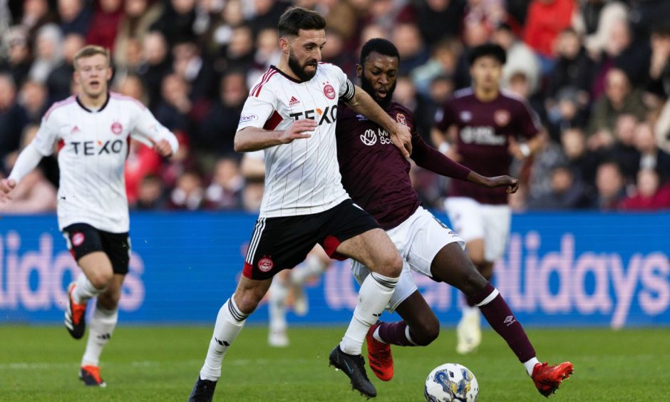 Hearts' Beni Beningime and Aberdeen's Graeme Shinnie in action at Tynecastle. 