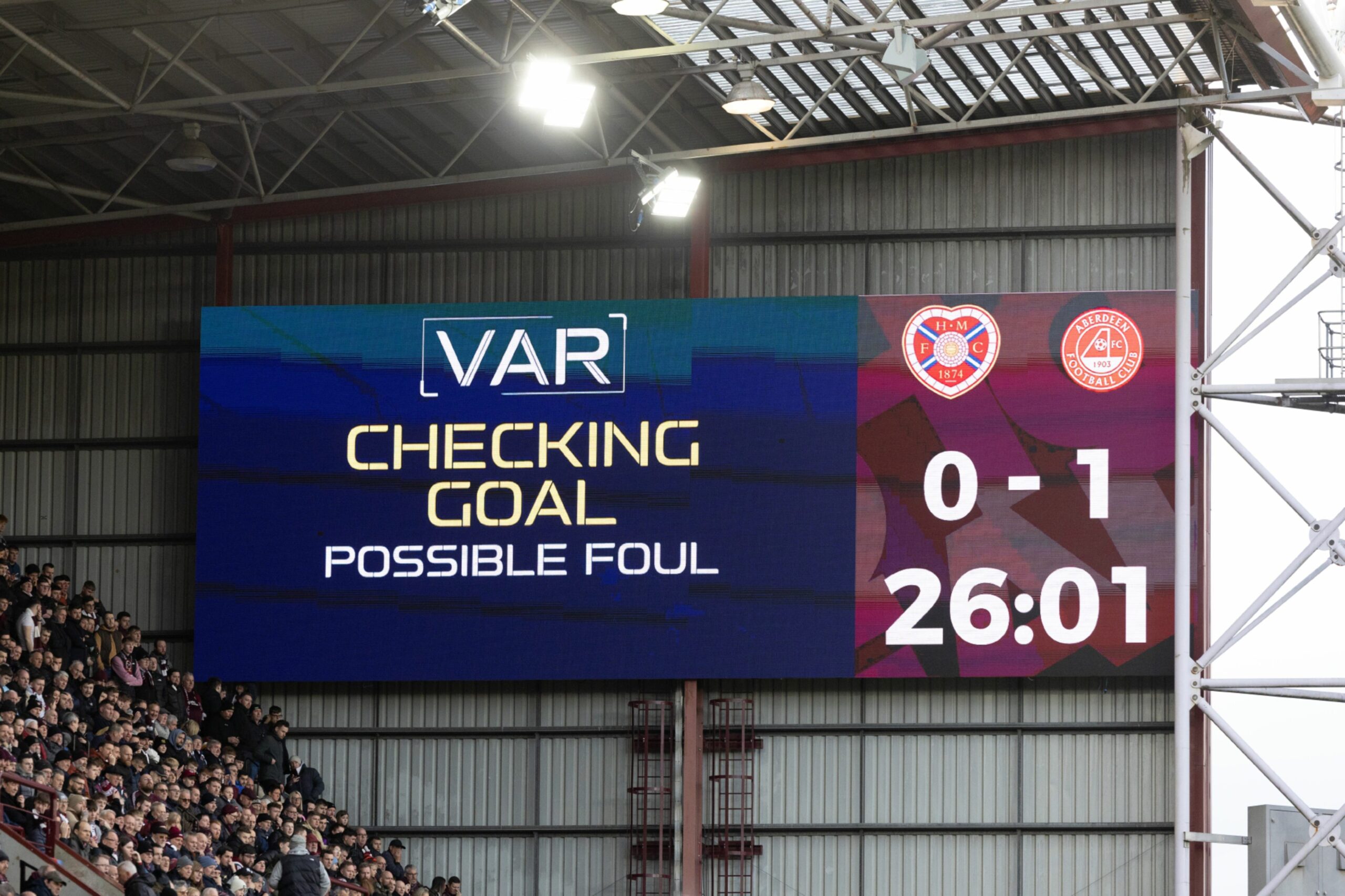  A VAR check takes place after Aberdeen's Bojan Miovski scores a disallowed goal against Hearts. Image: SNS 
