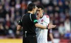 Aberdeen's Bojan Miovski looks unhappy with referee Kevin Clancy after his goal is disallowed against Hearts at Tynecastle. Image: SNS