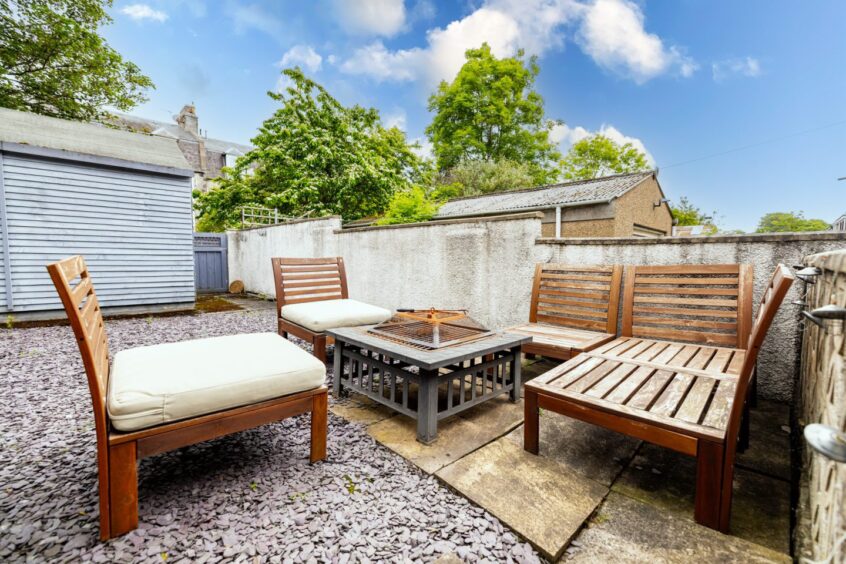 Seating area in the back garden of the renovated Aberdeen home.
