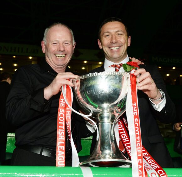 Chairman Stewart Milne, left, and manager Derek McInnes celebrate the Dons' League Cup success in 2014.