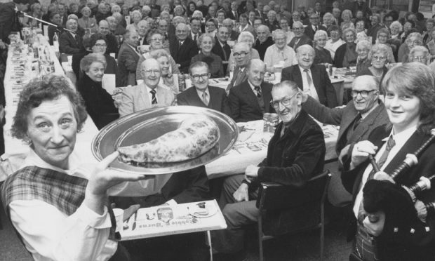 1987: Retired Norco employees were treated to the last Burns Supper to be held in Norco House Restaurant. The guests watched the haggis being piped in, carried by catering assistant Nan Bruce and Cherie Morrison of Bon Accord Ladies Pipe Band followed on. Image: DC Thomson