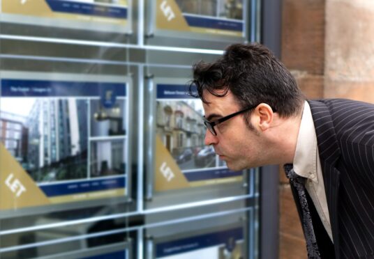 Business man looks at property prices in Aberdeen 2024