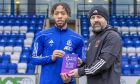 Cove Rangers striker Rumarn Burrell collects his League One player of the month award from manager Paul Hartley. Image: Cove Rangers FC.