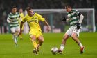 Buckie Thistle's Joe McCabe, left, plays the ball away from Celtic's Paulo Bernardo. Pictures by Darrell Benns/DCT Media.