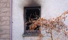 A burned out window following yesterday's fatal flat fire in Aberdeen