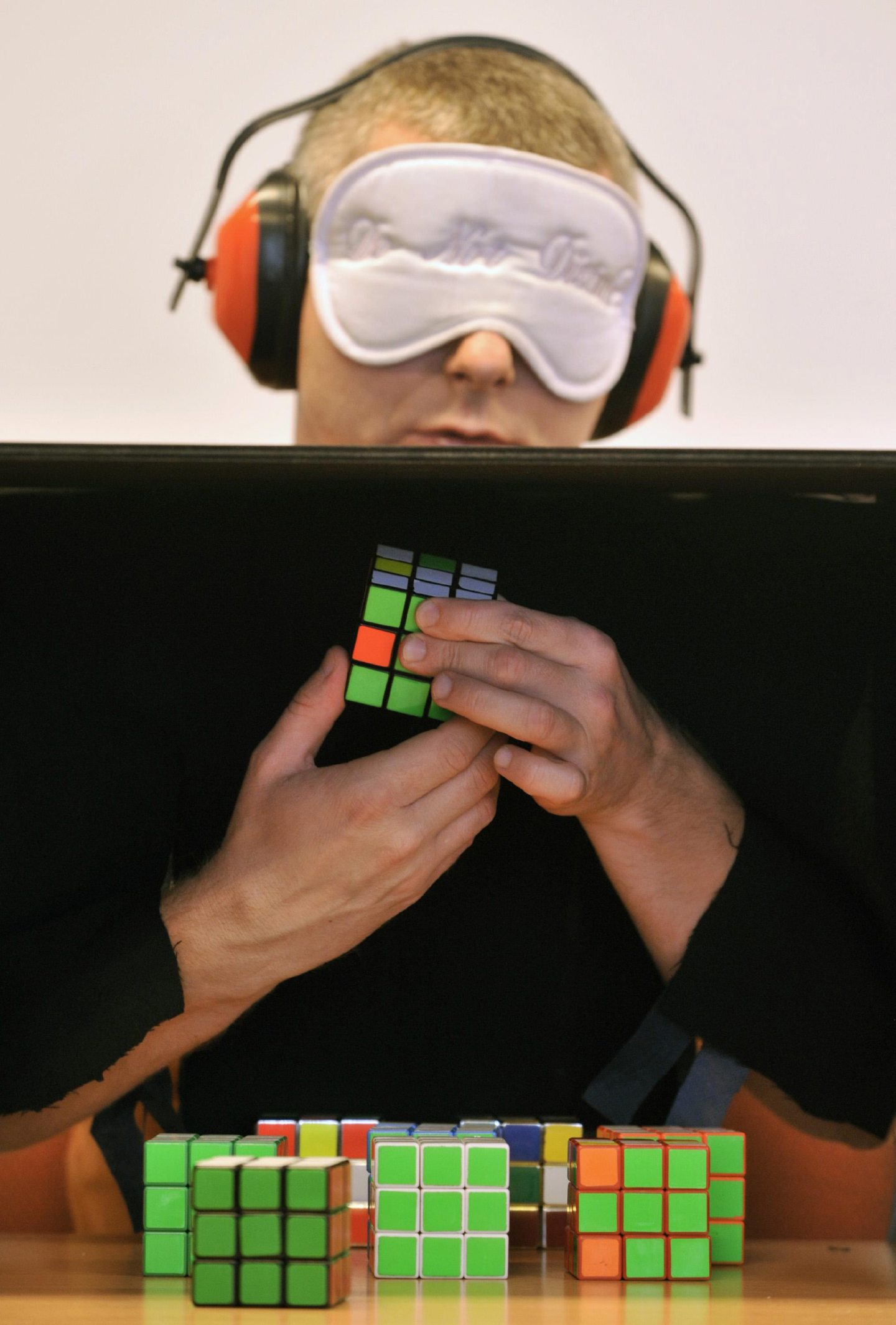 A participant in the annual Rubik Cube Hungarian Open Championships solves nine 3x3 cubes blindfolded after memorizing all of them in Budapest, Hungary