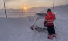 Hardangervidda in Norway on May 26 2023 with a car completely covered in snow.