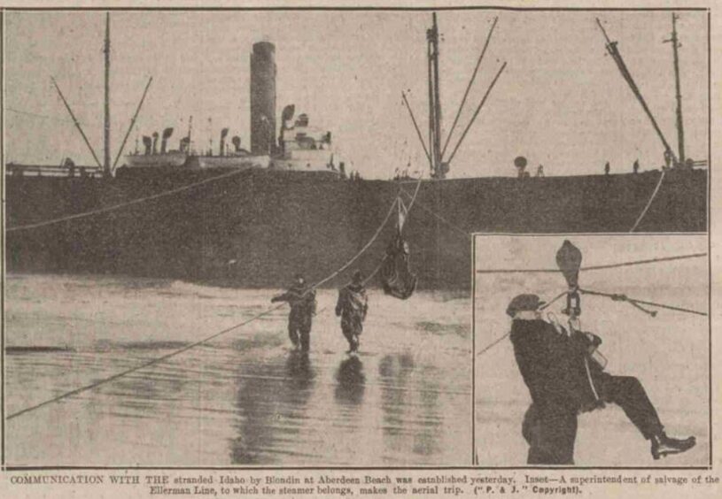 Rope system attached to the American steamship to establish communication. Inset shows a salvage man on his way over to the vessel. 