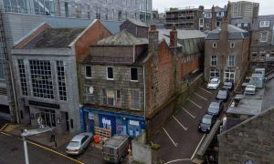 Could a disagreement over how to spruce up a crumbling building waylay major revamp plans?