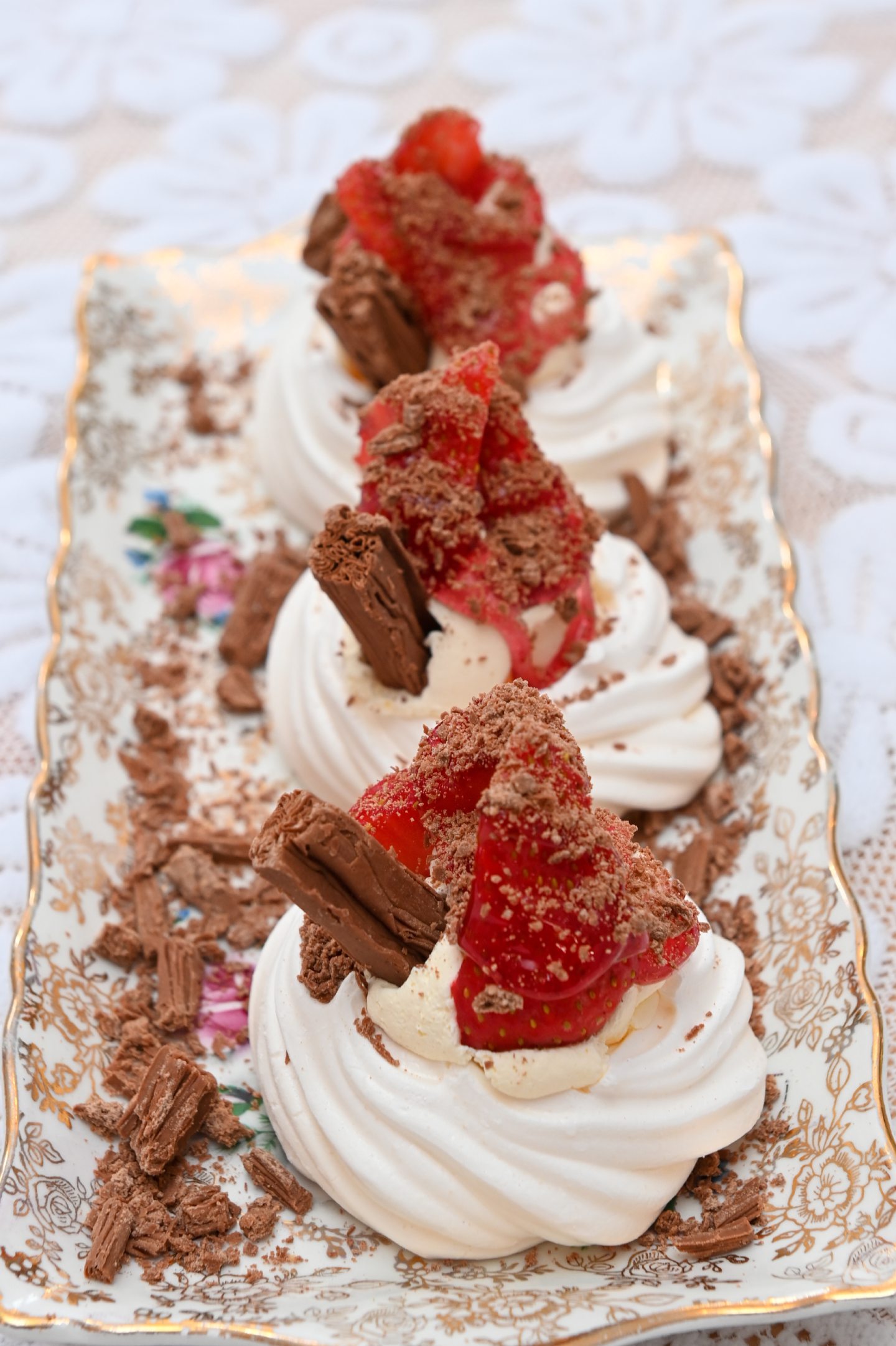 Three strawberry meringues from Nooks & Crannies with chocolate flakes on top