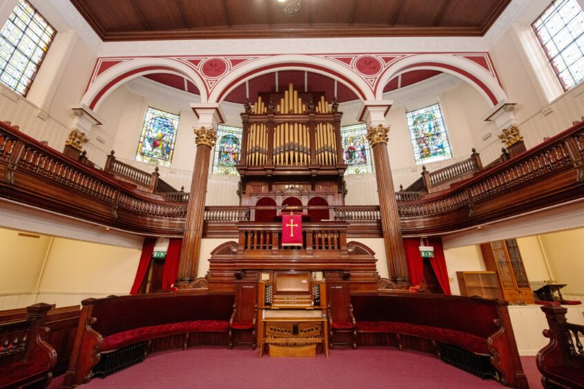 A view of the church organ and upper floor from the pews