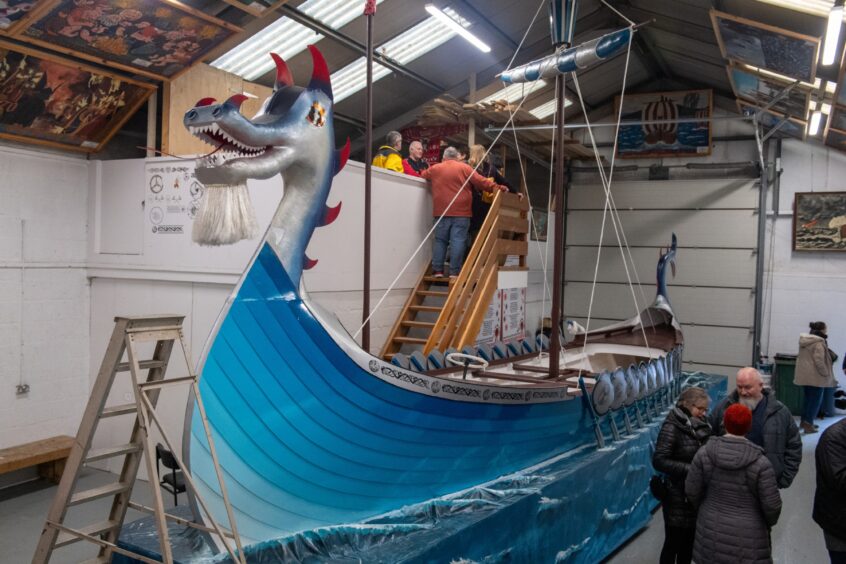 Up Helly Aa: Men work on finishing the galley 