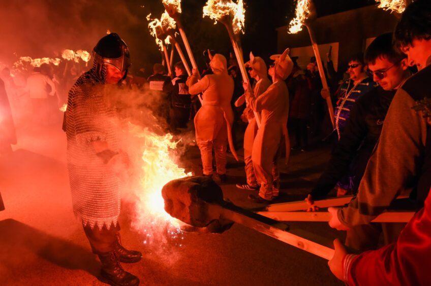 Flares are lit at the start of the parade