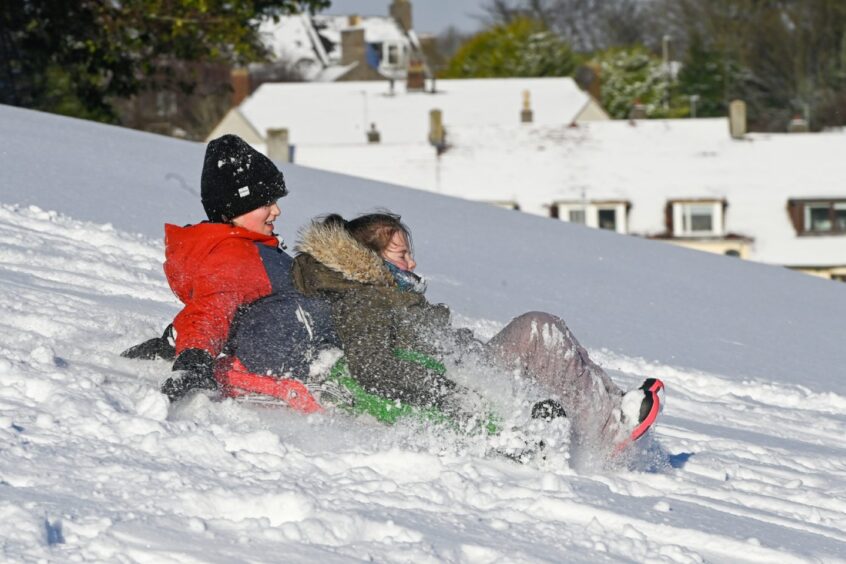 Aberdeen fun in the snow on Garthdee sled hill.