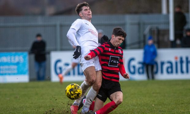 Jay Halliday of Inverurie Locos, right, makes a tackle on Brora Rangers' Max Ewan. Pictures by Kath Flannery/DCT Media
