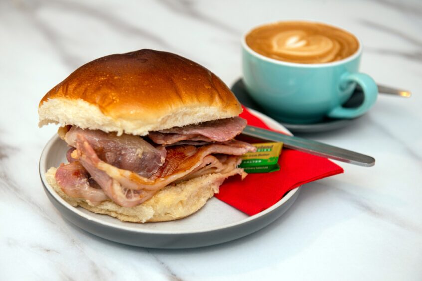 A bacon roll and coffee at The Long Dog Cafe in Aberdeen.